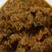 Lamb Curry · Boneless lamb cooked in tomatoes, onions, fresh herbs and spices.