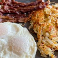House Breakfast · With two XL eggs, choice of bacon or sausage or ham, hash browns or grits, toast or two panc...