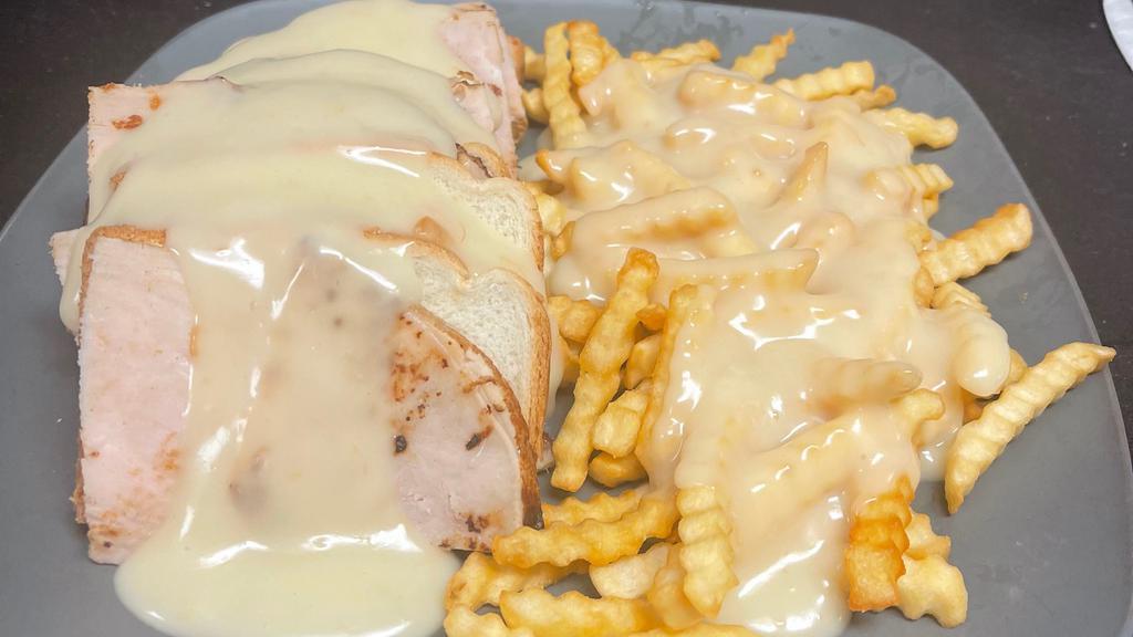 Hot Turkey · With mashed potatoes and chicken gravy.