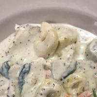 Giuseppe Special · Grilled chicken and shrimp in garlic cream parmesan sauce served with baby spinach and roast...