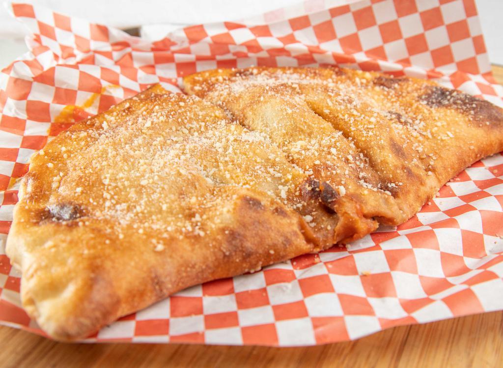3 Topping Calzone · Your choice of Sauce and Cheese included plus 3 toppings. Topped with Garlic Butter and Parmesan Cheese.