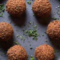 Falafel · Vegetarian. Ground chickpeas with parsley, onions, and garlic (6-pieces)