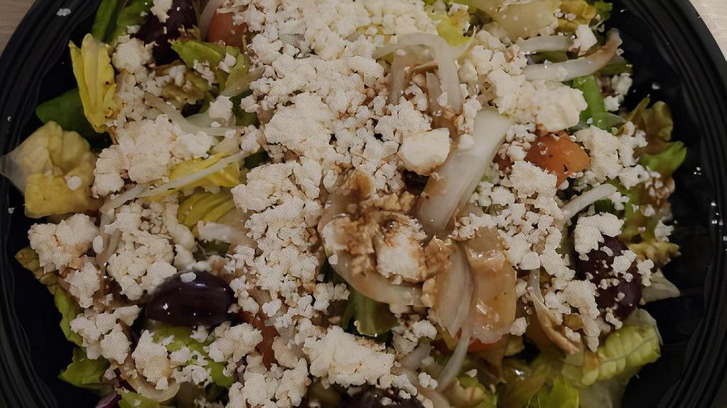 Mediterranean Salad · Vegetarian. Romaine lettuce, tomatoes, cucumbers, onions, black olives, and feta cheese (served with balsamic vinaigrette).