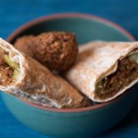 Falafel Wrap · Vegetarian. Ground chickpeas with parsley, served with hummus, Jerusalem salad, tomatoes, an...