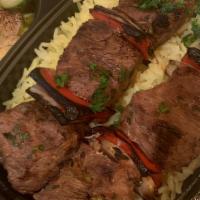 Beef Shish Kabob Entrée | Fillet · 2 skewers of grilled pieces of marinated beef tenderloin served with rice, salad, hummus, an...
