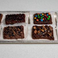 Brownie Triple Treat · Topped with your choice of: snickers, white cholocate chip, peanut butter chip, reese's, m&m...