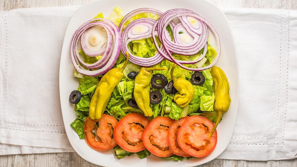 Garden Salad · Romaine lettuce, tomatoes, red onions, pepperoncini, and black olives.