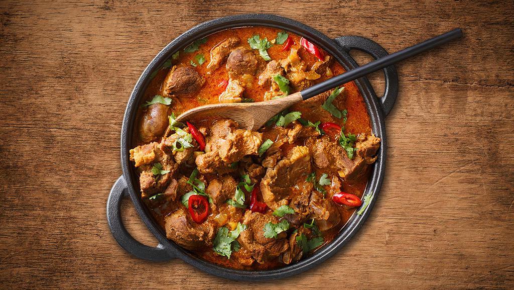 Lamb Rogan Josh · Tender meat well marinated and cooked with ginger, garlic yogurt, onion, tomato, and spiced flavour curry sauce made of Indian herbs and spices.
