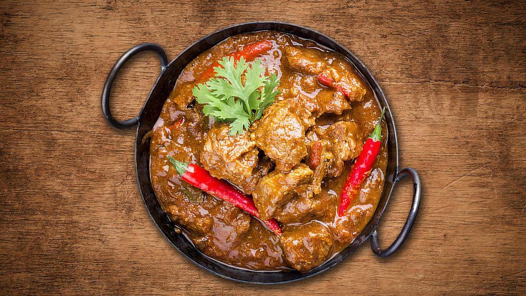 United Lamb Curry  · Pieces of Lamb cooked in a classic brown curry with Indian whole spices.