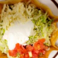 Taco Salad · Crispy flour shell served with your choice of ground beef or chicken with lettuce, tomatoes,...