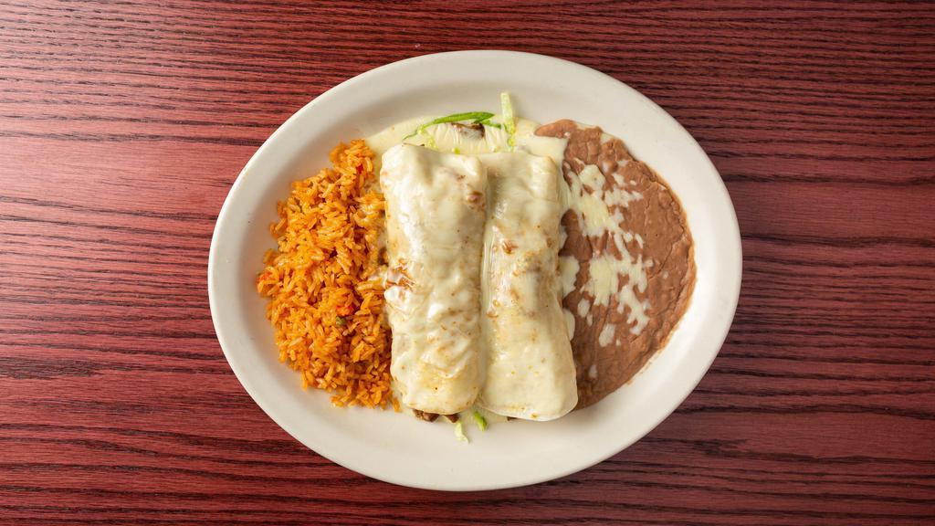 Flacos Burritos · Two steak and cheese burritos with lettuce, served with rice and beans.