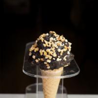 Ice Cream Sundae Cone · A scoop of old fashioned vanilla on top of a sugar cone, dipped in chocolate and sprinkled w...