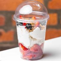 Yogurt Parfait · Low fat vanilla yogurt, topped with fresh seasonal fruit and granola.