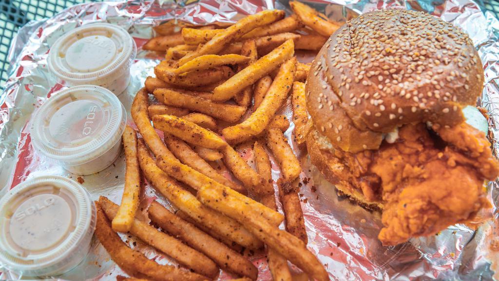 Spicy Chicken Sandwich Served With Fries · crispy hand battered chicken breast dip in our nyc hot sauce lettuce pickles on a brioche bun