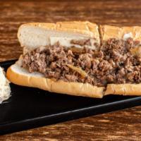 Tay'S Cheesesteak · White American or Pepper Jack cheese with grilled onions.