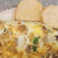 Farmers Omelette · Sausage, green peppers, onions with the hash browns inside.