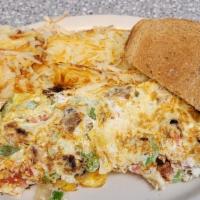 Tempeh Omelette · Tempeh, Green Peppers, Onions, & Tomatoes, hash brown included.