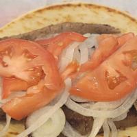 Gyro Sandwich · Served off the skewer with onions, tomatoes and homestyle gyro sauce.
