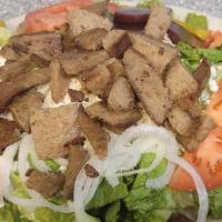 Large Greek Gyro Salad  · Lettuce, tomatoes, olives, pepperoncini, beets. Onions, and feta cheese. Served with pita br...