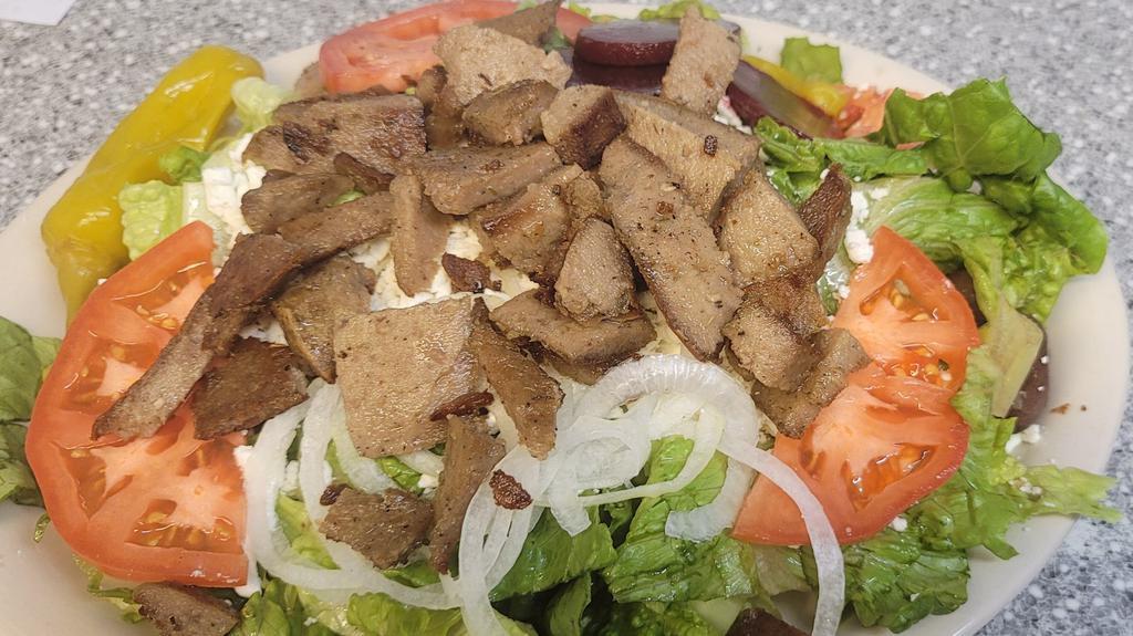 Large Greek Gyro Salad  · Lettuce, tomatoes, olives, pepperoncini, beets. Onions, and feta cheese. Served with pita bread.