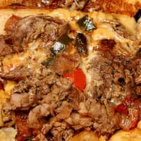 Flyer Cheese Steak · Chopped grilled roast beef, peppers, onions, chili con queso on a hoagie roll.