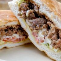 Regular Torta · Mexican sandwich served on a soft roll and filled with Beans, avocado, tomatoes, onions, and...