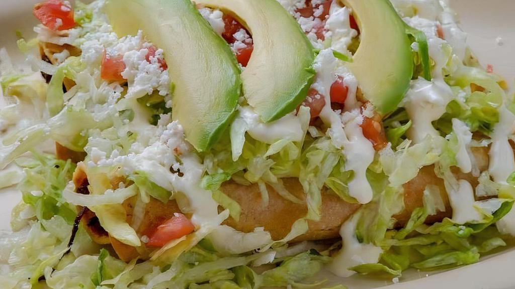 Flautas (No Rice- No Beans) · Rolled up fried corn tortillas stuffed with chicken or shredded beef. topped with lettuce, sour cream tomato