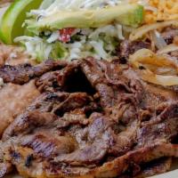 Carne Asada · Grilled steak. blend onions & fried jalapelio. served with rice, refried beans, salad & tort...