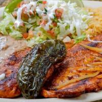Pechuga A La Plancha · Grilled chicken breast. served with rice. refried beans. salad & tortillas.