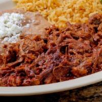 Platillo De Deshebrada · Shredded beef topped with cilantro & onions. Served with rice and beans.