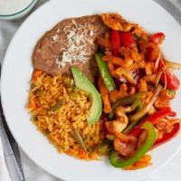 Fajitas De Pollo · Grilled chicken breast with bell peppers and onions.