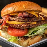 Double Hamburger (1/2 Lb) · Pure-beef made-to-order burgers served on a toasted bun, mustard, ketchup, grilled onions, p...