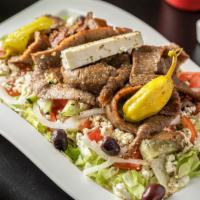 Gyro Salad · Our famous grecian salad topped with hand-carved gyro.
