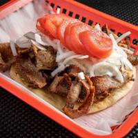 Gyro Plate · Hand-carved gyro served with our homemade tzatziki sauce, Feta, sliced onions, tomato, 2 pit...