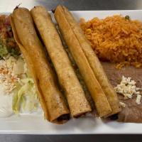 Flautas De Pollo · Three crispy fried rolled corn tortilla, with cheese, sour cream, lettuce, guacamole and pic...