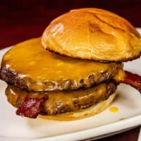 Bacon Double Cheese Burger · Two 1/3 lb  Black Angus Beef patties, bacon and Cheddar on a grilled brioche bun.