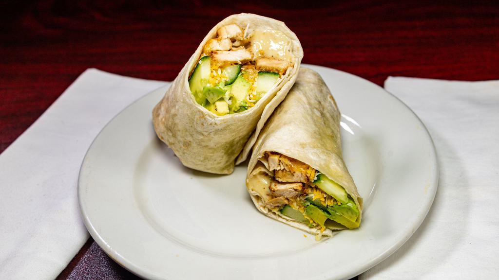 California Chicken Wrap · Chicken with avocado, cucumber, Cheddar Jack and roasted garlic mayo wrapped in a tortilla.