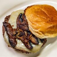 Mushroom Swiss Burger · 1/3 lb  Black Angus Beef patty, grilled onion, portabella mushroom and Swiss on a grilled br...
