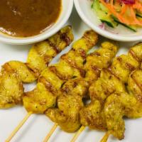 Chicken Satay · Gluten free.  Marinated chicken, skewered and grilled, served with homemade peanut sauce and...