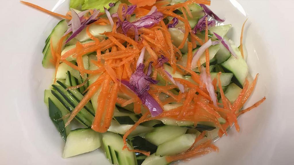 Cucumber Salad · Gluten free. Fresh sliced cucumber, red onion and carrot with homemade Thai sweet and sour dressing. Gluten free.