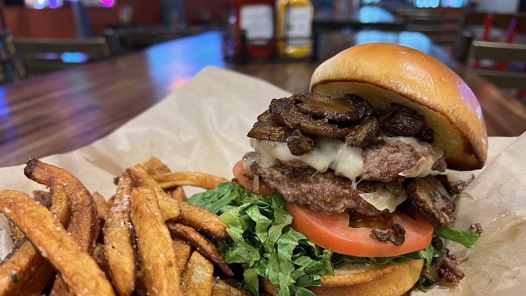 Mushroom & Swiss · Two 3-ounce patties smashed and flash grilled, topped with a generous amount of mushrooms, lettuce, and tomato.