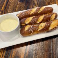 Soft Pretzel Sticks · Served warm and lightly salted. Cheese sauce on side.