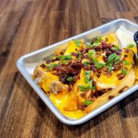 Loaded Potato Wedges · Sliced potato wedges topped with melted Colby-Jack cheese, bacon bits and green onion. Sour ...
