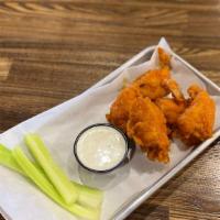 Boneless Wings · Hand-battered and fried. Available in three sizes with choice of sauce or dry rub.