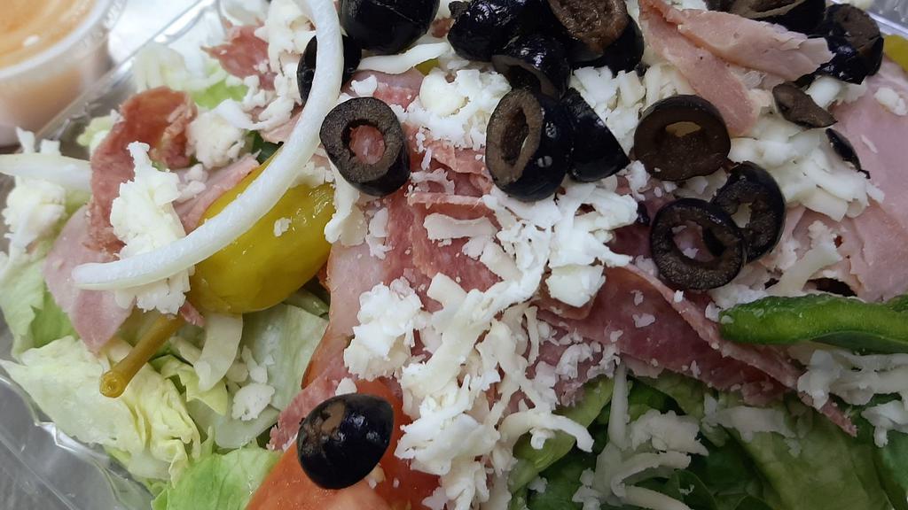 Antipasto Salad · Lettuce, tomatoes, onions, green peppers, black olives, mozzarella, pepperoncini, ham, and salami.