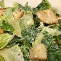 Caesar Salad · romaine lettuce, parmesan cheese, and croutons all tossed with a creamy caesar dressing.