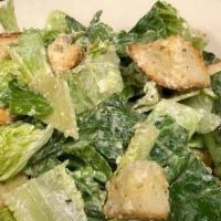 Side-Caesar Salad · romaine lettuce, parmesan cheese, and croutons all tossed with a creamy caesar dressing.