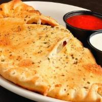 Calzone · Pizza dough topped with marinara sauce, mozzarella cheese, and your favorite pizza toppings,...