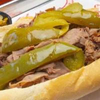 Italian Beef · Served with choice of sweet or giardiniera peppers on grilled French bread.