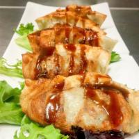 Pan Fried Duck Dumpling · Canton style roact duck with raisins, dried piums, and shiitake mushrooms.